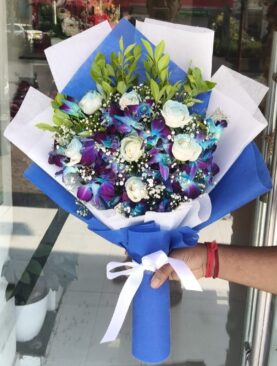 Blue orchids and white roses elegance